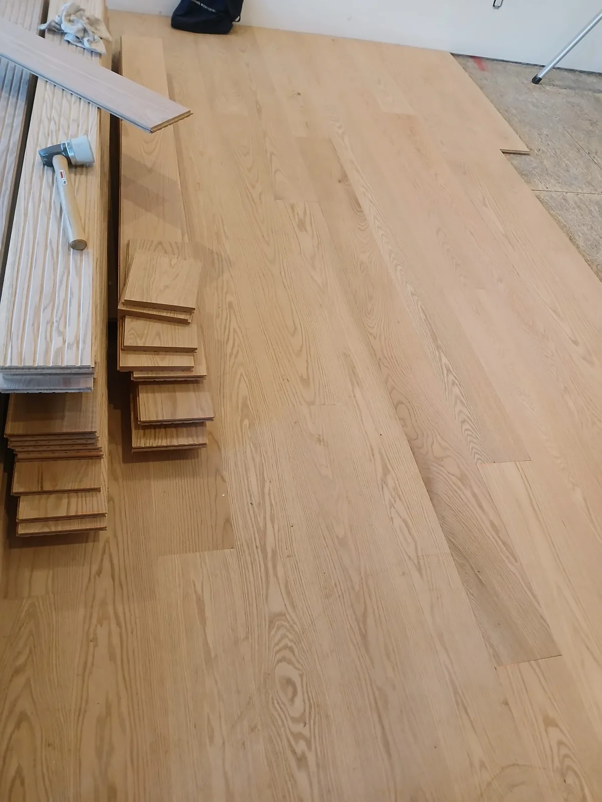 Red oak hardwood flooring mid-installation