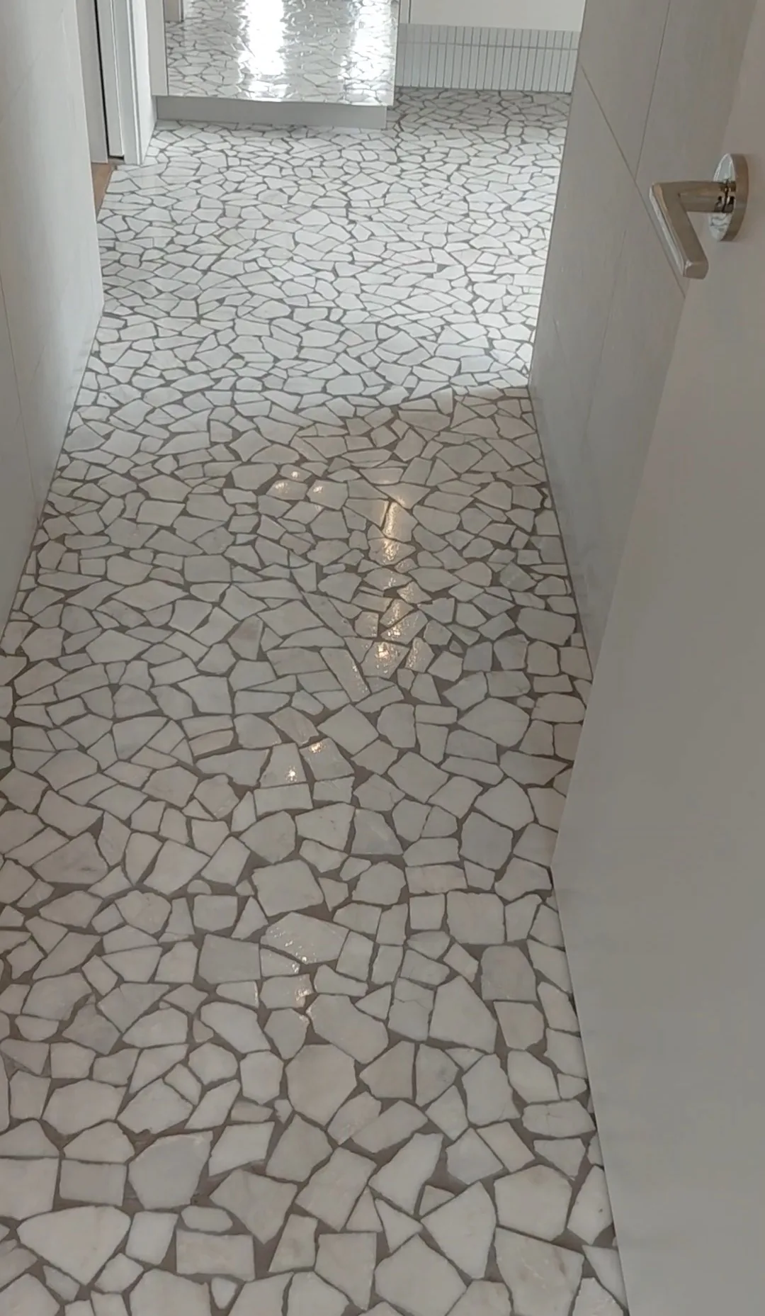 Broken-marble mosaic floor set and polished